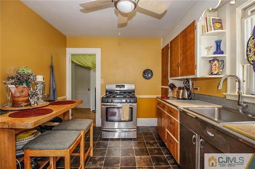 67 Pleasant Avenue Edison, NJ 08837 - Photo 18 of 25 a kitchen with a sink and a stove top oven