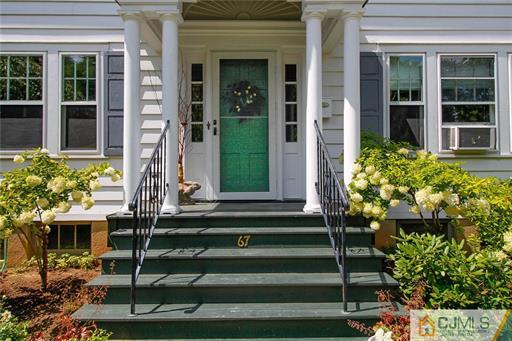 67 Pleasant Avenue Edison, NJ 08837 - Photo 3 of 25 a front view of a house with a garden