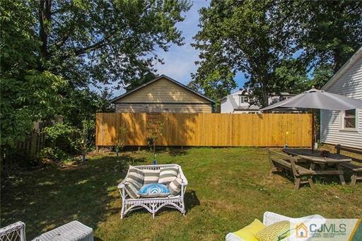 67 Pleasant Avenue Edison, NJ 08837 - Photo 24 of 25 a backyard of a house with table and chairs
