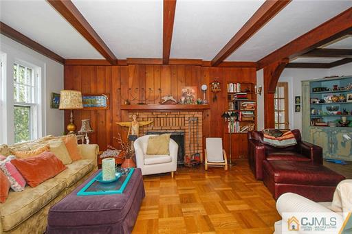 67 Pleasant Avenue Edison, NJ 08837 - Photo 7 of 25 a living room with furniture and a fireplace