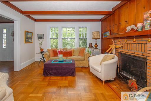 67 Pleasant Avenue Edison, NJ 08837 - Photo 8 of 25 a living room with furniture and a fireplace