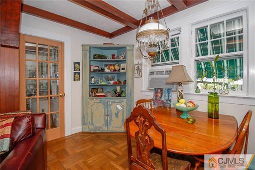 67 Pleasant Avenue Edison, NJ 08837 - Photo 9 of 25 a dining room with furniture a rug and a chandelier