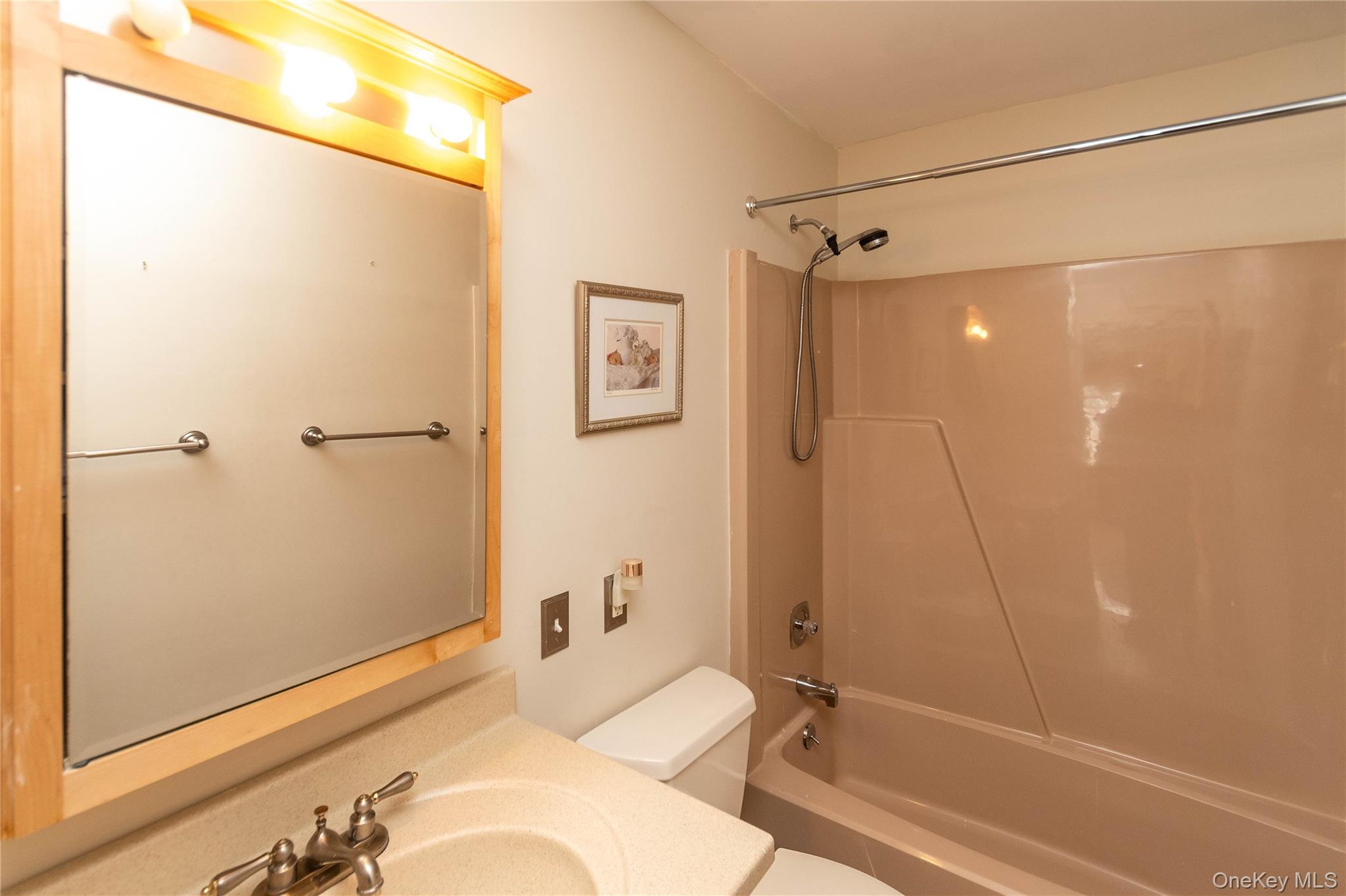 113 Village Road, Unit B Yorktown Heights, NY 10598 - Photo 16 of 25 a bathroom with a sink and shower