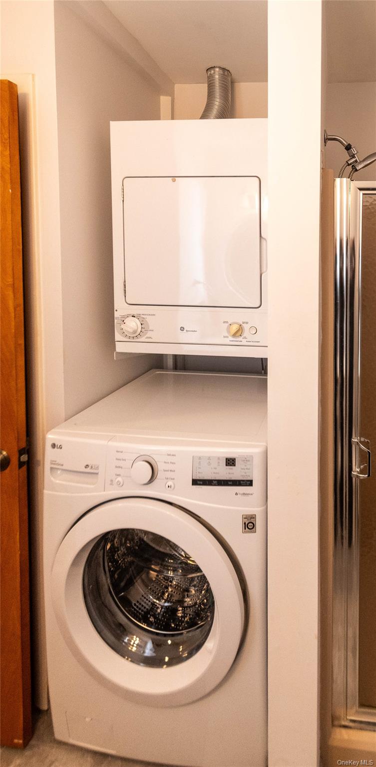 113 Village Road, Unit B Yorktown Heights, NY 10598 - Photo 22 of 25 a utility room with dryer and washer