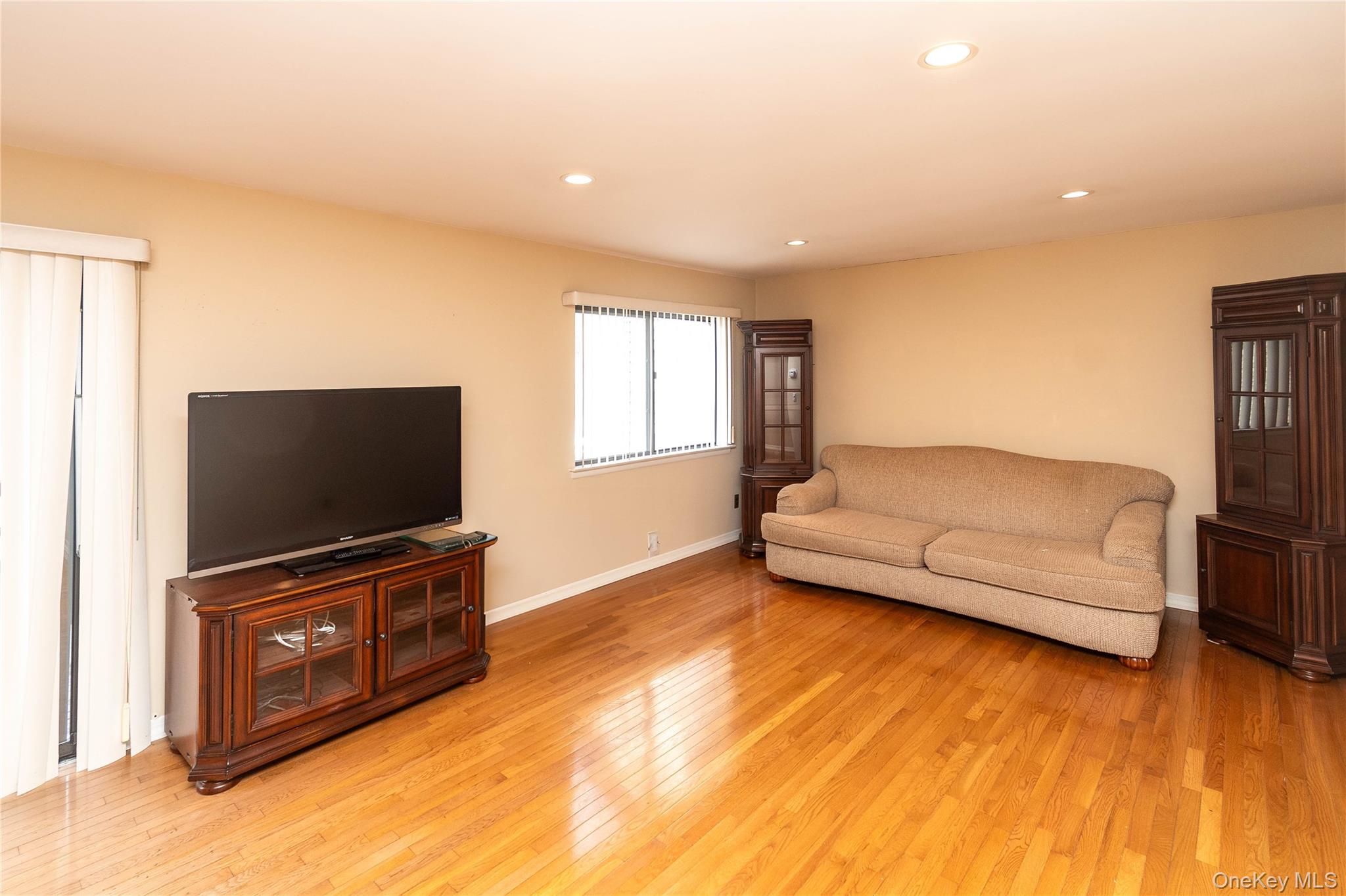 113 Village Road, Unit B Yorktown Heights, NY 10598 - Photo 10 of 25 a living room with furniture and a flat screen tv