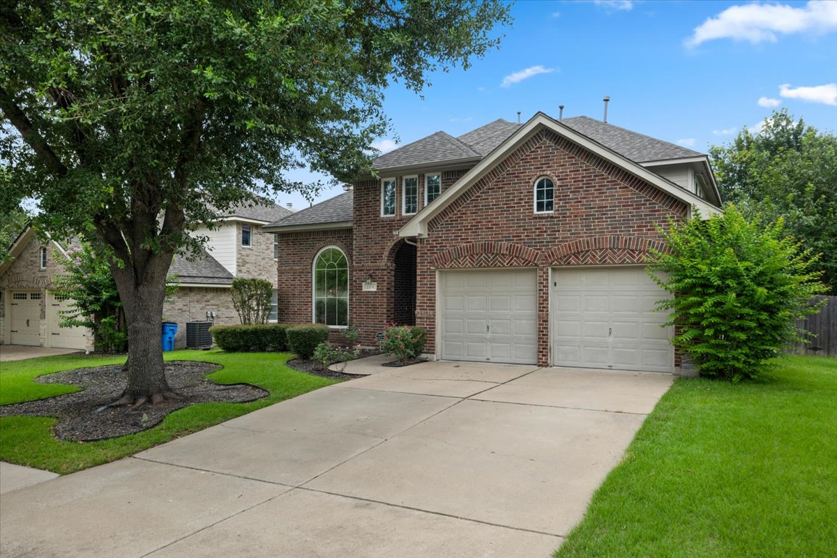 2304 Village View Loop Pflugerville, TX 78660 - Photo 1 of 40 A well-maintained brick facade and verdant landscaping welcome you home.