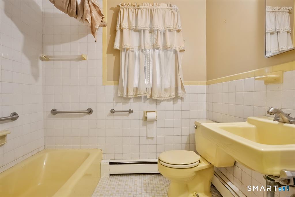 732 Tunxis Hill Road Fairfield, CT 06825 - Photo 19 of 21 a bathroom with a sink and toilet