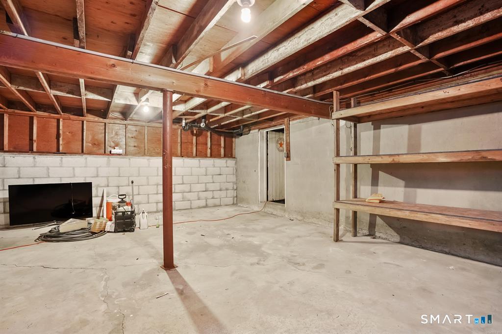 732 Tunxis Hill Road Fairfield, CT 06825 - Photo 20 of 21 a view of an empty room with a fireplace