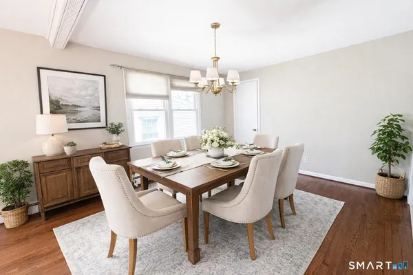 a view of a dining room with furniture and window