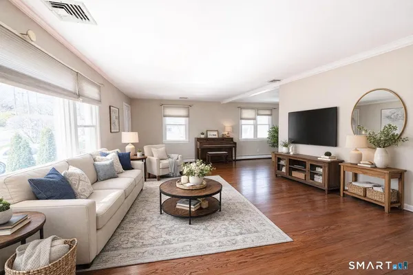 a living room with furniture and a flat screen tv