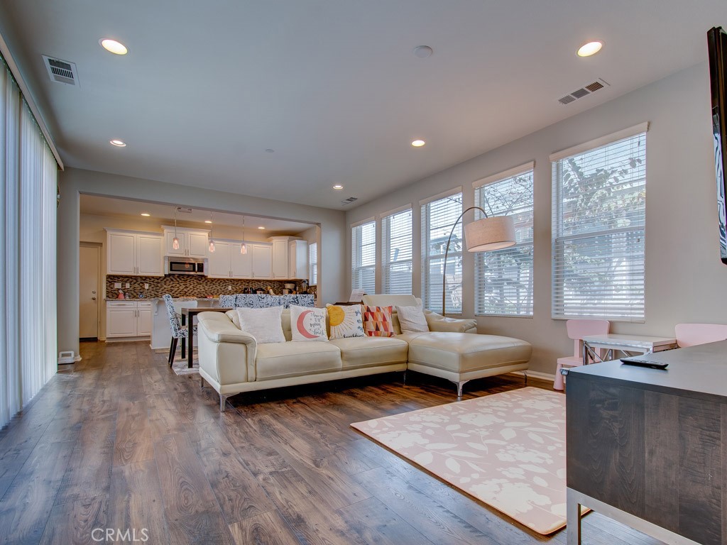 147 Acamar Irvine, CA 92618 - Photo 11 of 52 a living room with furniture and large windows