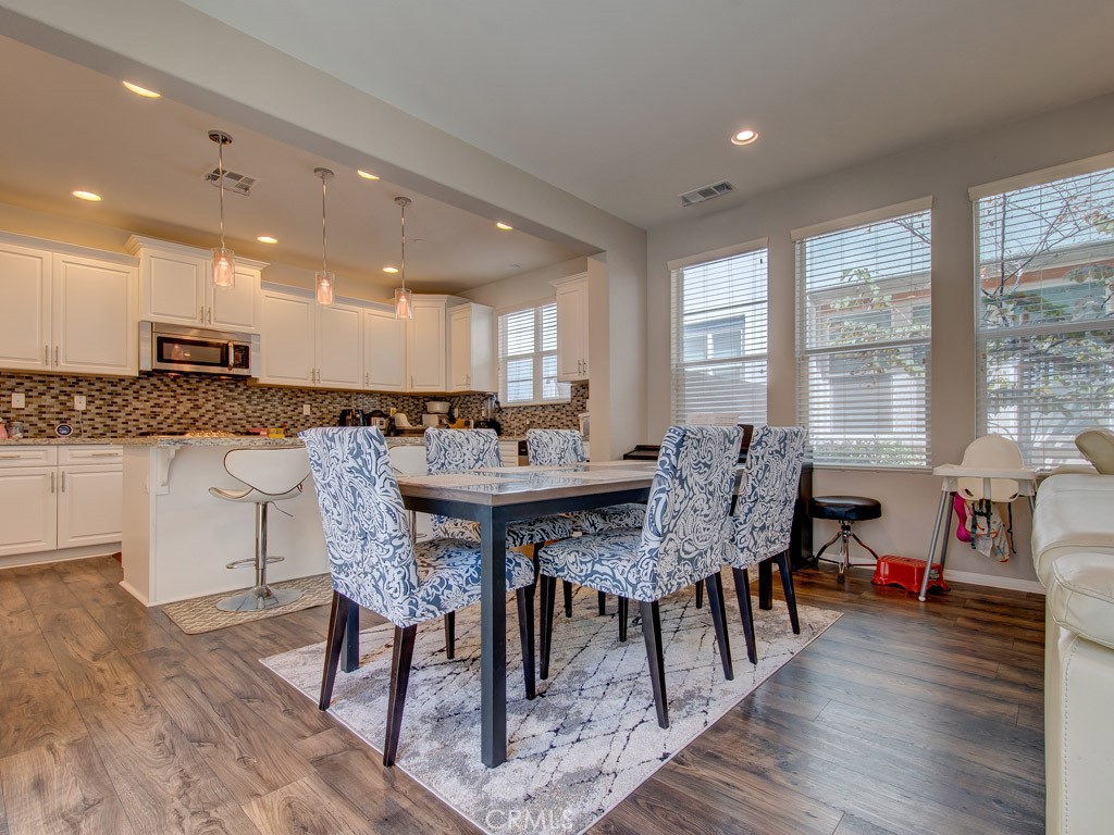 147 Acamar Irvine, CA 92618 - Photo 16 of 52 a view of a a dining room with furniture window and wooden floor