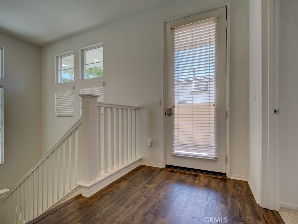 147 Acamar Irvine, CA 92618 - Photo 24 of 52 a view of an empty room with wooden floor and a window