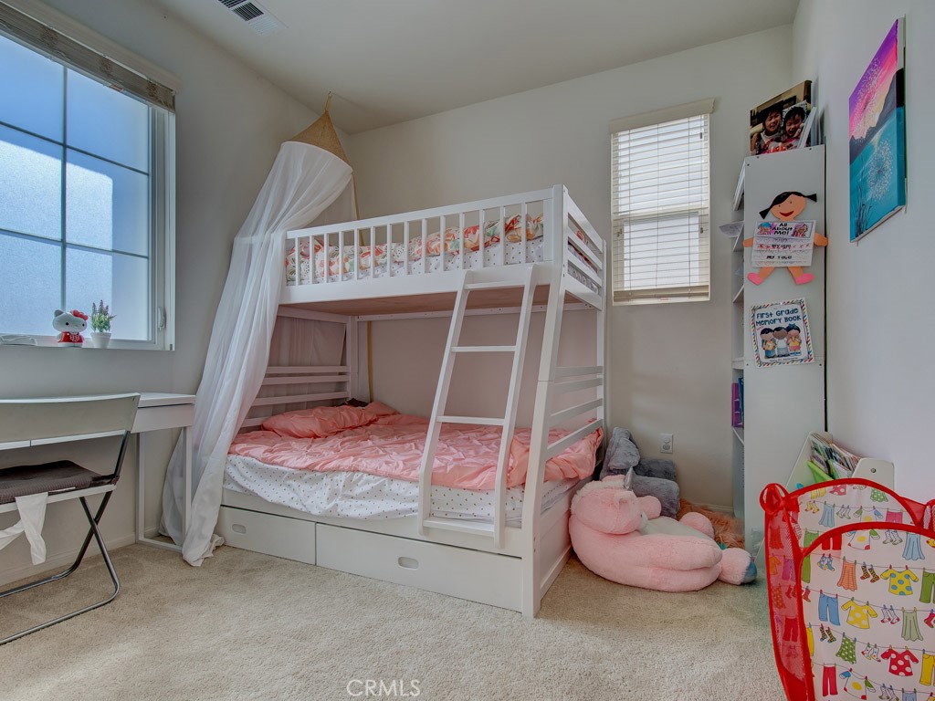 147 Acamar Irvine, CA 92618 - Photo 26 of 52 a bedroom with a bed and a window