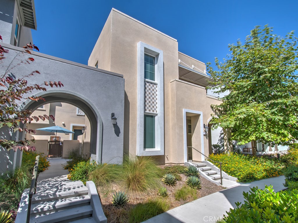 147 Acamar Irvine, CA 92618 - Photo 3 of 52 a front view of a house with a garden