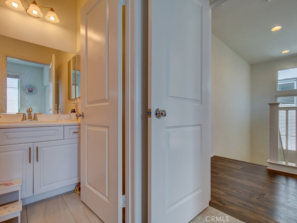 147 Acamar Irvine, CA 92618 - Photo 31 of 52 a bathroom with a sink and a mirror