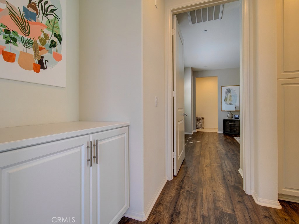 147 Acamar Irvine, CA 92618 - Photo 34 of 52 a view of a hallway with wooden floor and closet