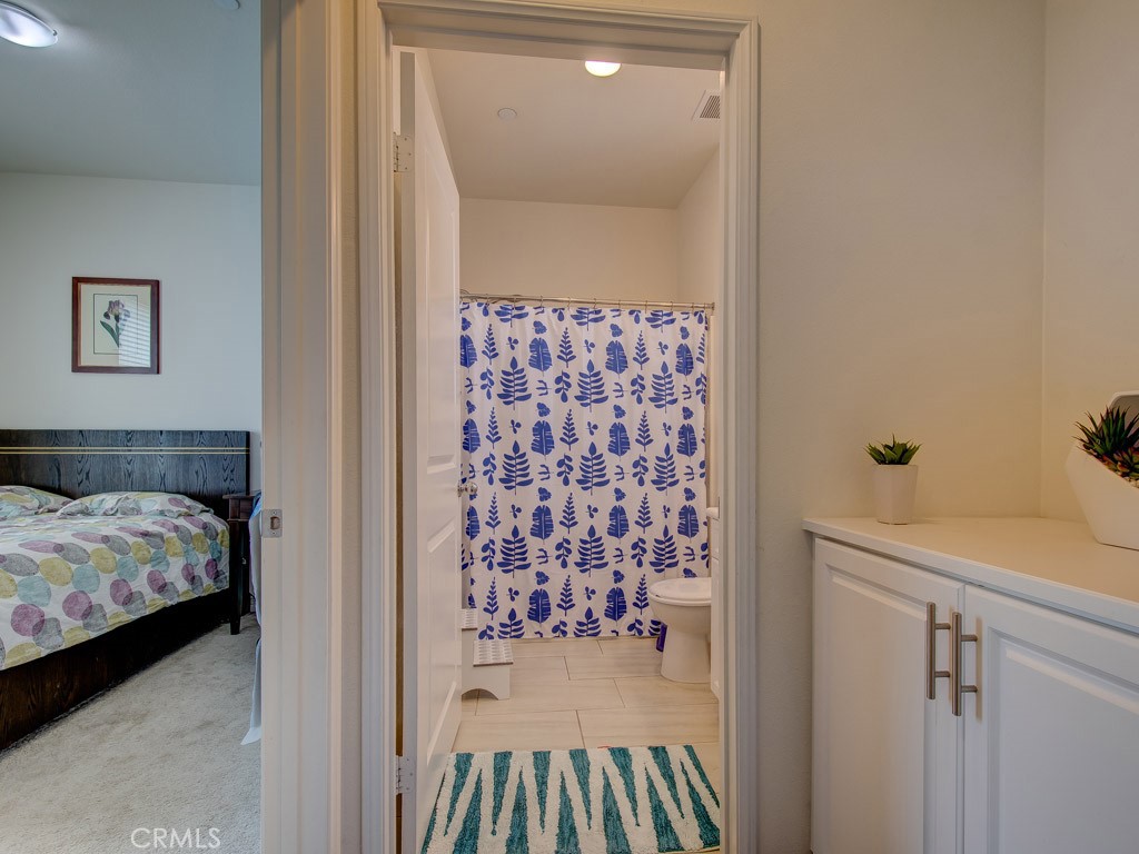 147 Acamar Irvine, CA 92618 - Photo 43 of 52 a bedroom with a bed and a mirror