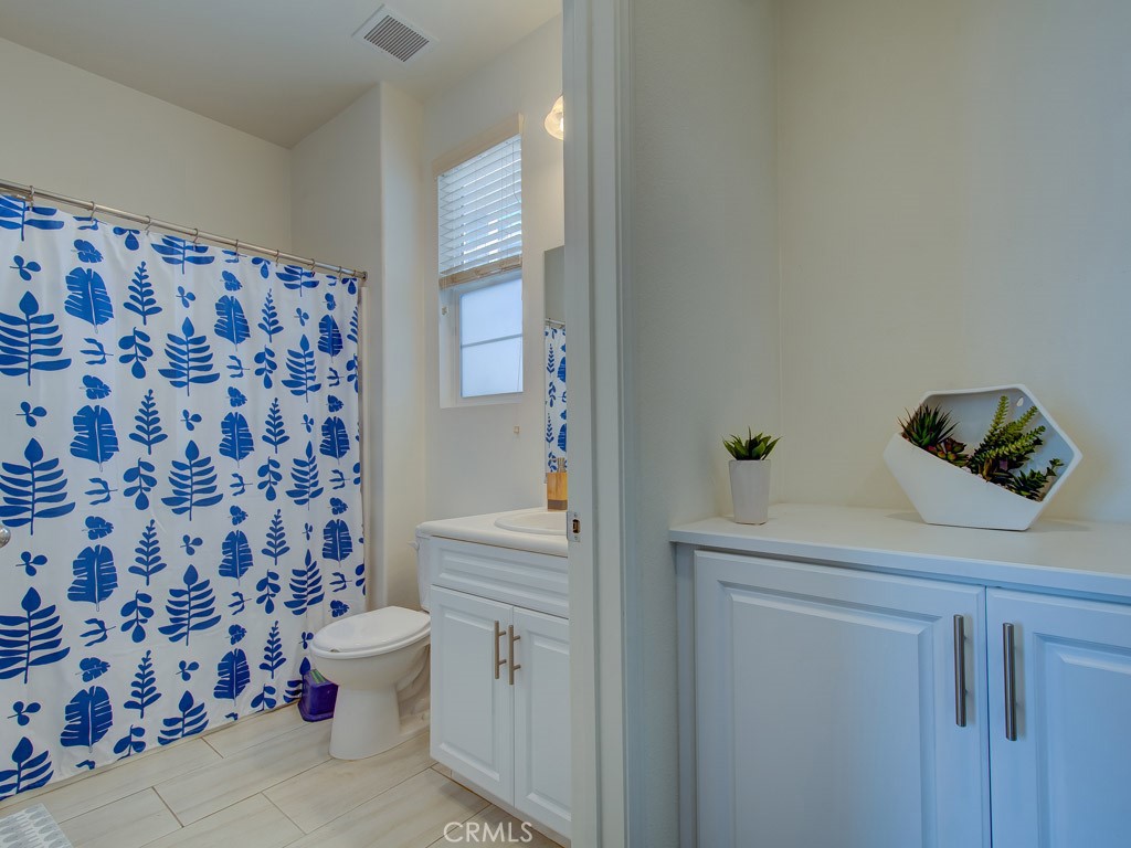 147 Acamar Irvine, CA 92618 - Photo 44 of 52 a bathroom with a bathtub and a shower