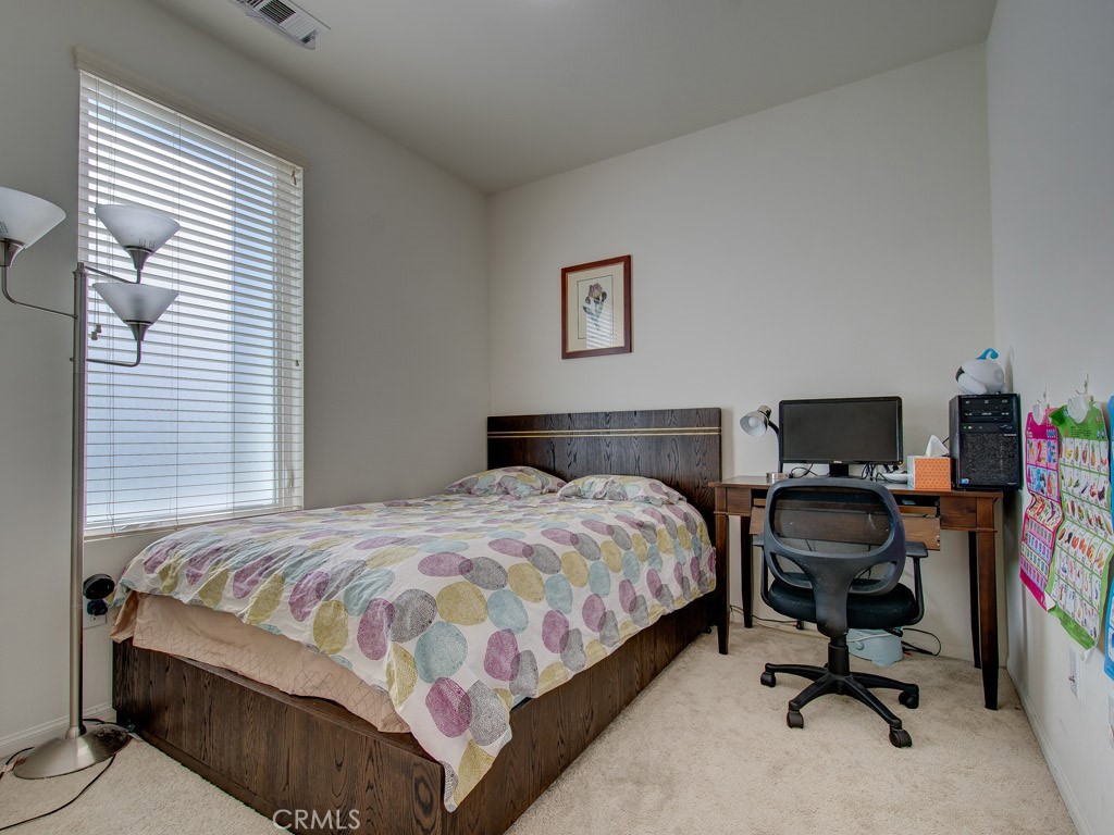 147 Acamar Irvine, CA 92618 - Photo 46 of 52 a bedroom with a bed and a desk