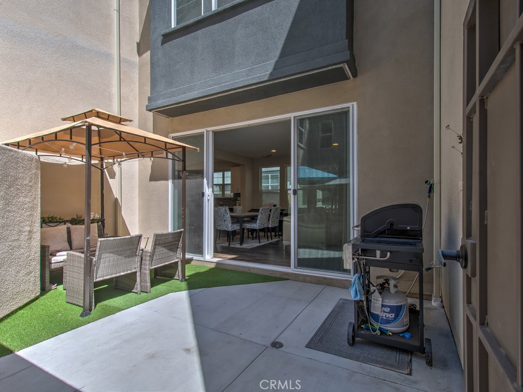 147 Acamar Irvine, CA 92618 - Photo 49 of 52 a patio with table and chairs