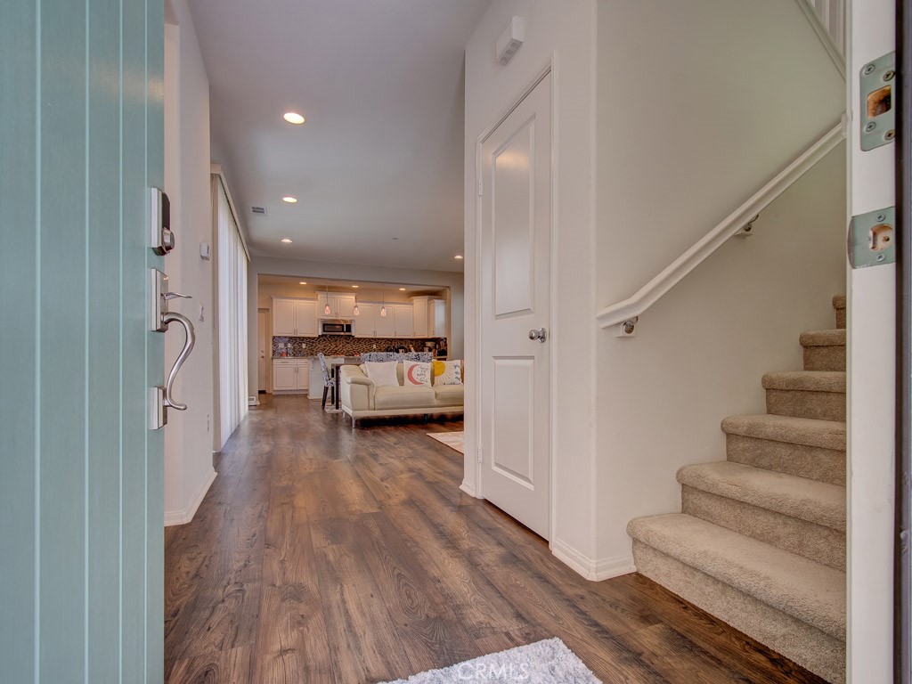 147 Acamar Irvine, CA 92618 - Photo 5 of 52 a view of a hallway view with wooden floor and staircase
