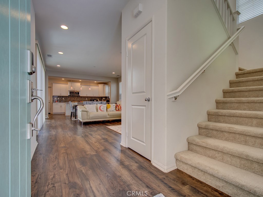 147 Acamar Irvine, CA 92618 - Photo 6 of 52 a living room with furniture and a wooden floor
