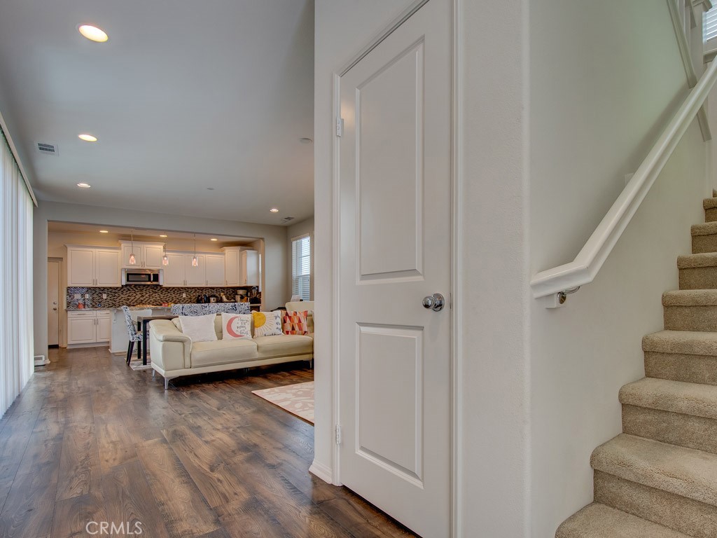 147 Acamar Irvine, CA 92618 - Photo 8 of 52 a living room with furniture and a wooden floor