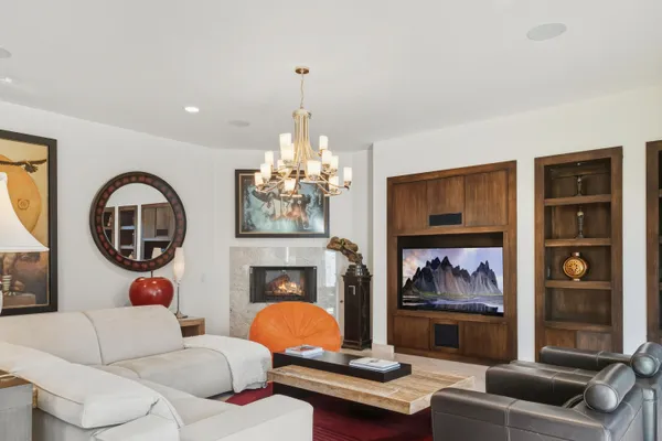 a living room with furniture windows and wooden floor