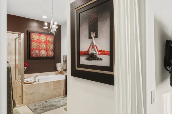 a bathroom with a double vanity sink mirror and shower