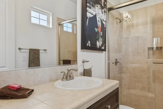 a bathroom with a sink and a mirror