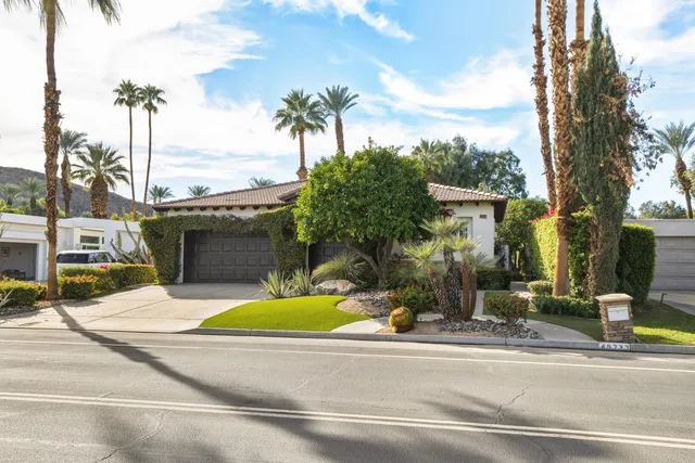 a view of a house with a yard porch and sitting area