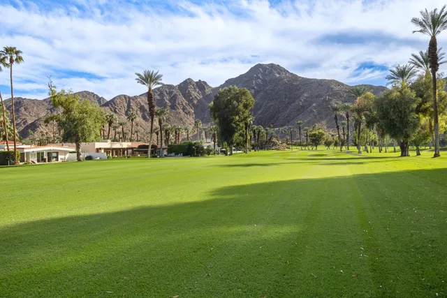 a view of a chairs and table in the garden