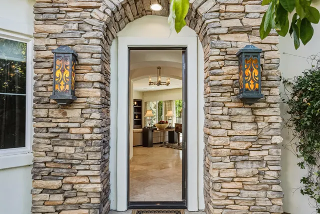 a view of a swimming pool with a patio and a yard