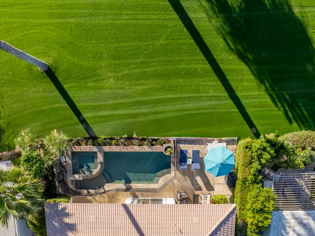 a living room with fireplace furniture and a flat screen tv
