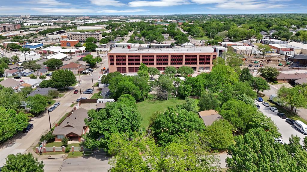 6868 Pecan Street Frisco, TX 75034 - Photo 5 of 8 Aerial perspective showcasing a mixed-use neighborhood with established residences and commercial buildings