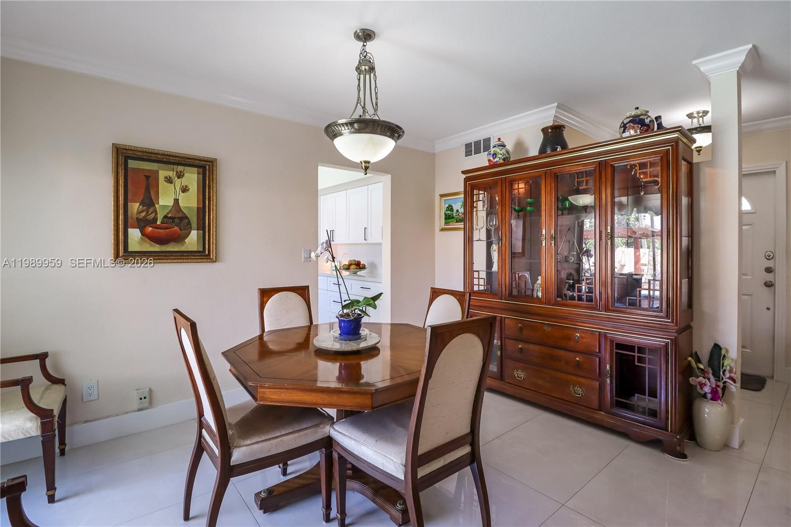 10941 Southwest 180th Street Miami, FL 33157 - Photo 12 of 29 a dining room with furniture a chandelier and window