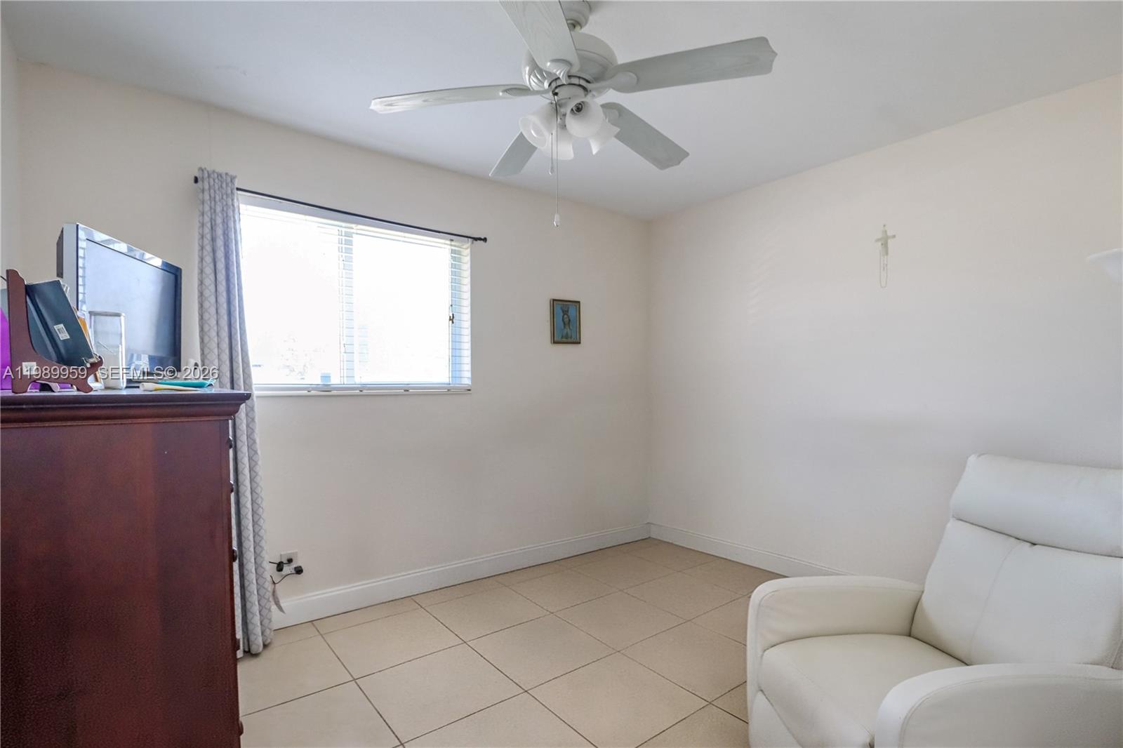 10941 Southwest 180th Street Miami, FL 33157 - Photo 18 of 29 a living room with furniture and a window