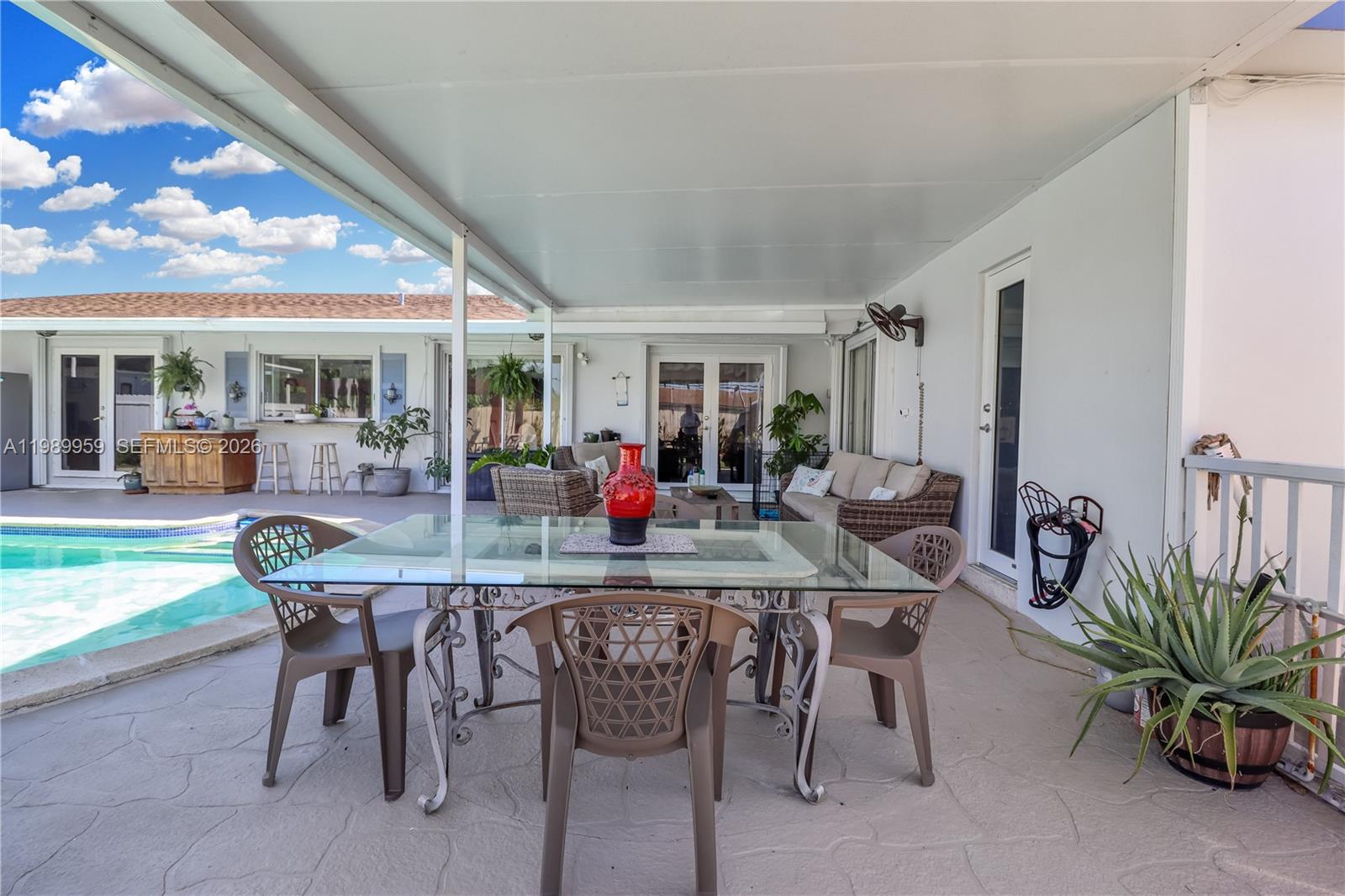10941 Southwest 180th Street Miami, FL 33157 - Photo 22 of 29 a view of a dining room with furniture and a potted plant