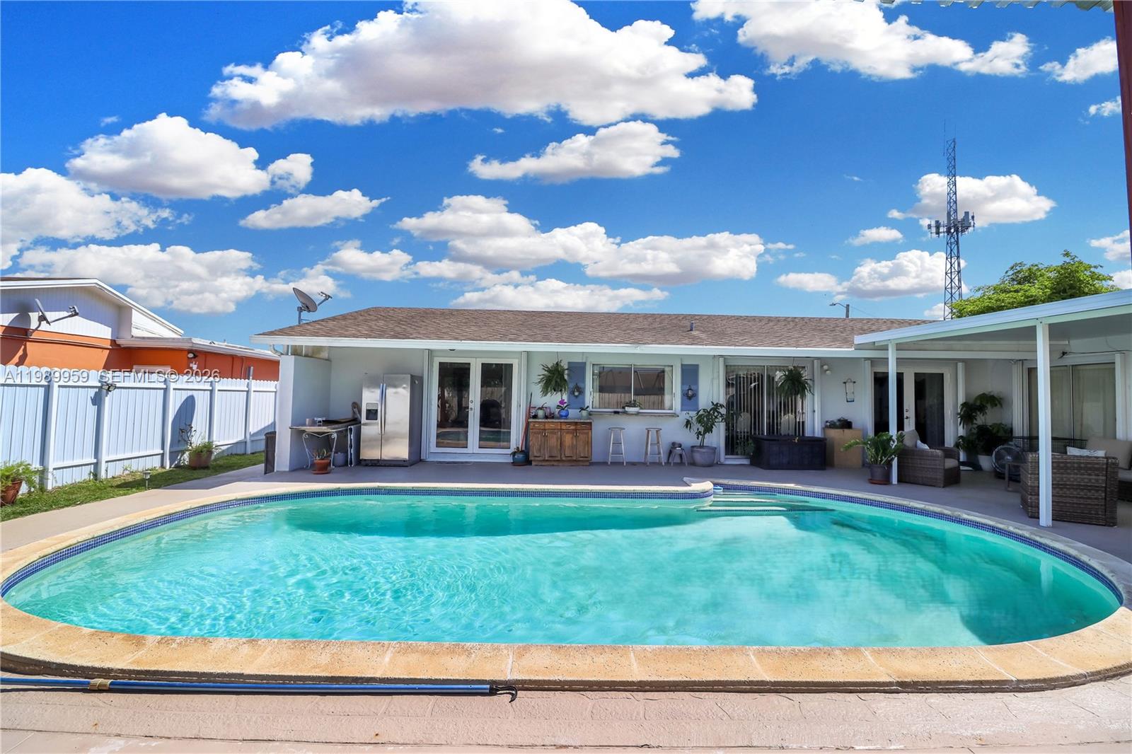 10941 Southwest 180th Street Miami, FL 33157 - Photo 24 of 29 a view of a house with a backyard porch and sitting area