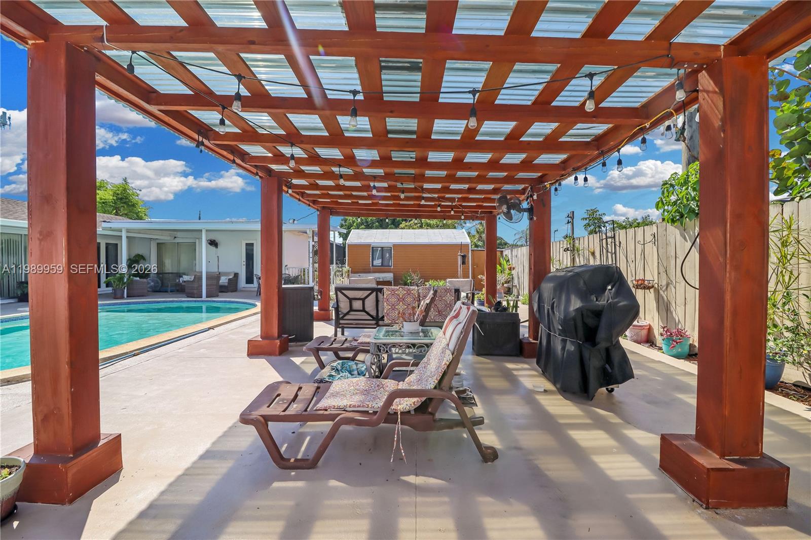 10941 Southwest 180th Street Miami, FL 33157 - Photo 26 of 29 a view of a porch with furniture and a yard
