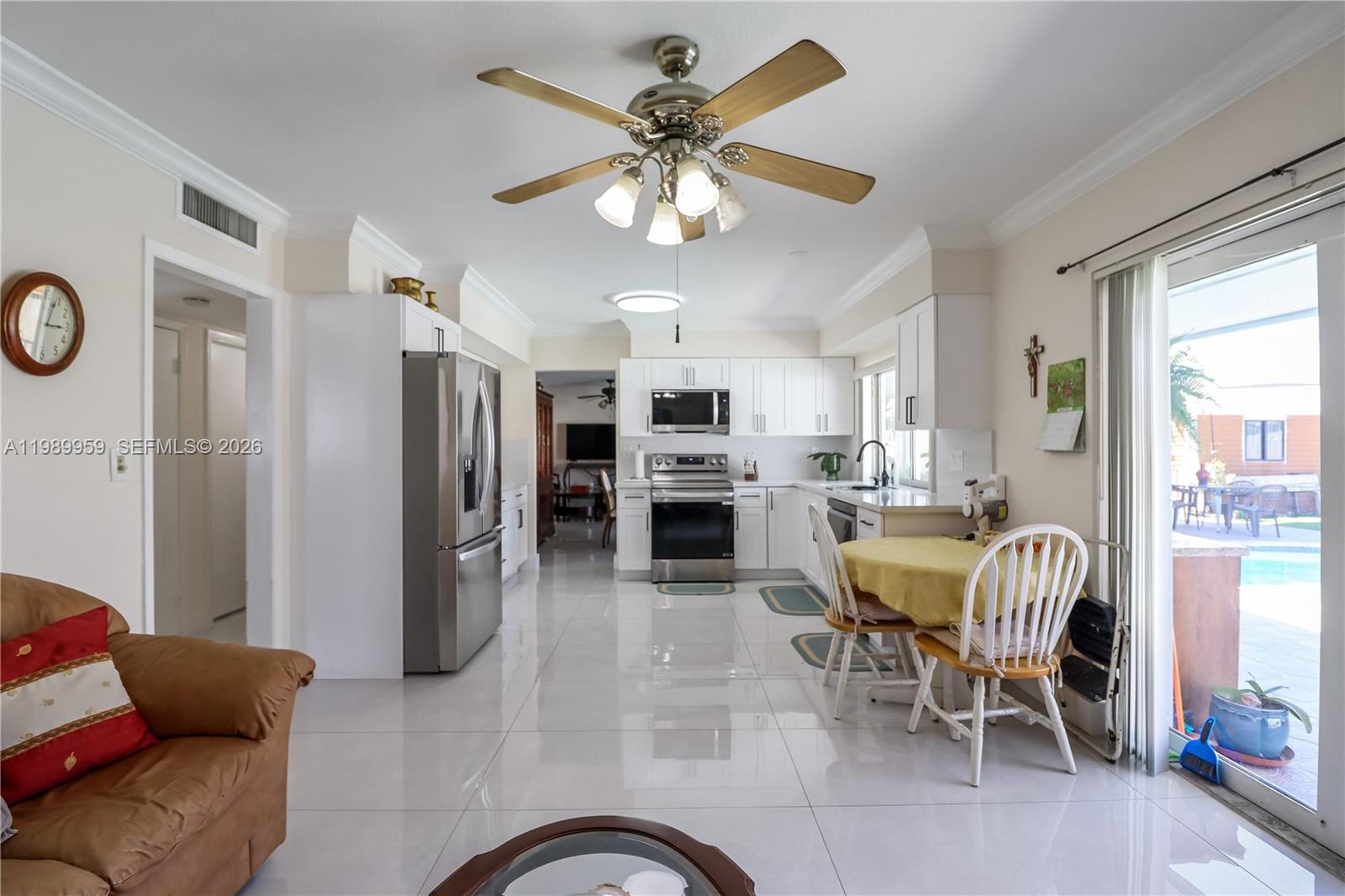 10941 Southwest 180th Street Miami, FL 33157 - Photo 10 of 29 a dining room with furniture and window