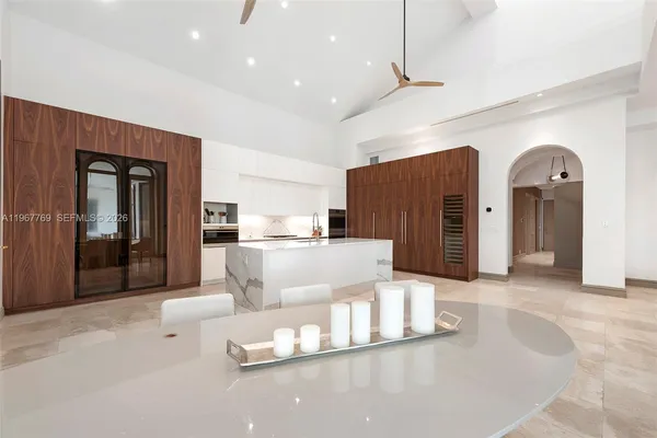 a living room with furniture and large windows