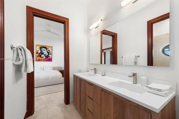 a bedroom with a bed and a couch
