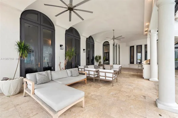 a view of a patio with swimming pool table and chairs