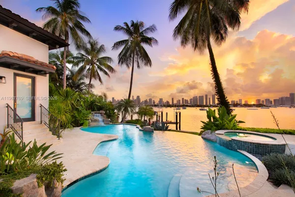 a swimming pool with outdoor seating and yard