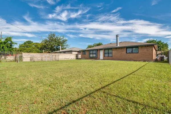 a view of house with yard