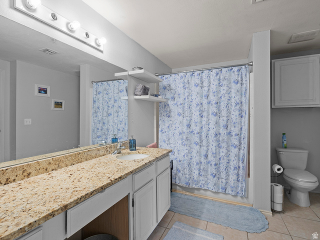 900 Bitner Road, Unit D 34 Park City, UT 84098 - Photo 16 of 25 Bathroom featuring vanity, light tile patterned floors, and shower / tub combo