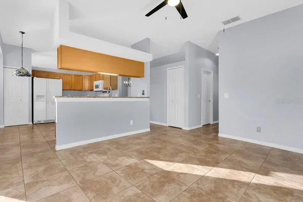a view of a kitchen with a sink and cabinets