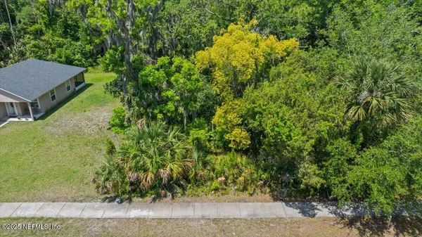 a front view of a house with parking space